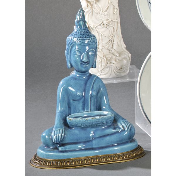 Buda sentado en loza turquesa