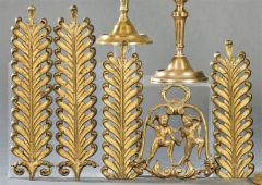 Dos parejas de bronces con decoración vegetal y otro en forma de campana con dos niños S.XIX.